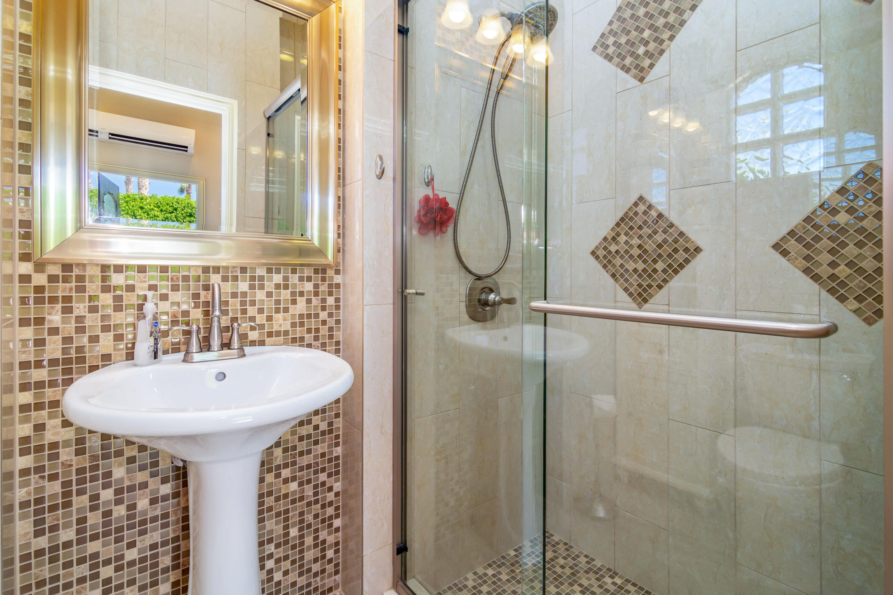 a bathroom with a sink and mirror