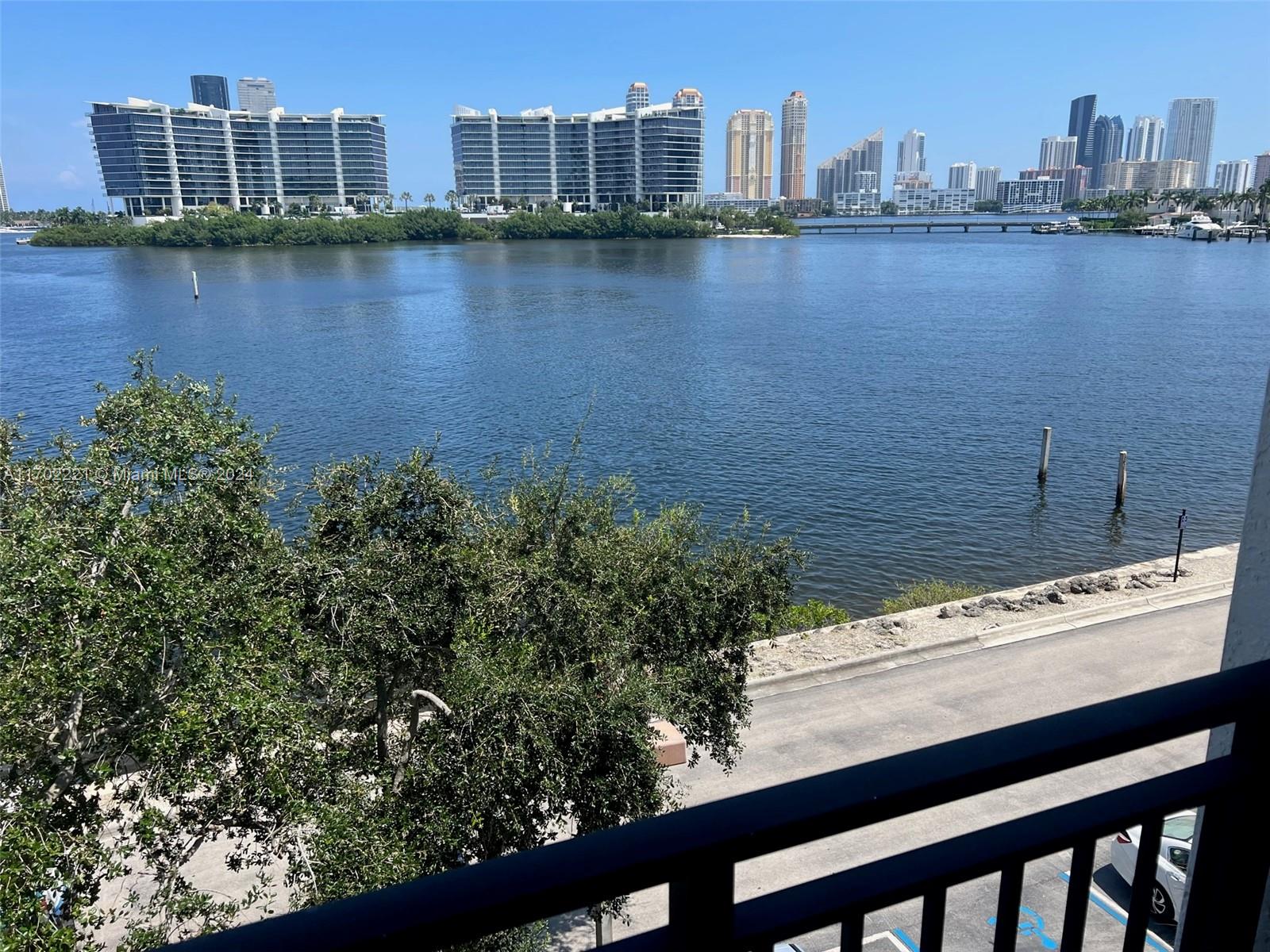 a view of a city with lake and city in the background