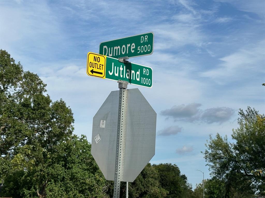 a sign that is on top of a pole