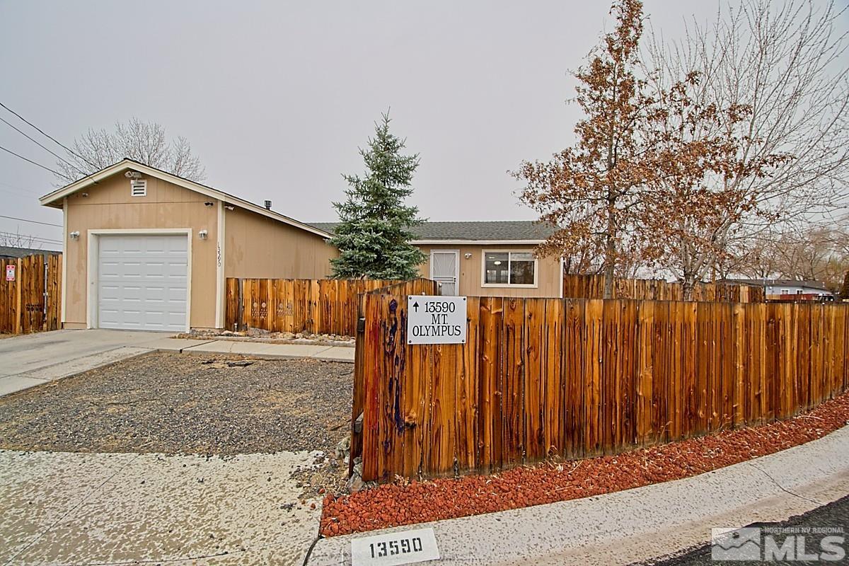 a front view of a house with a garage