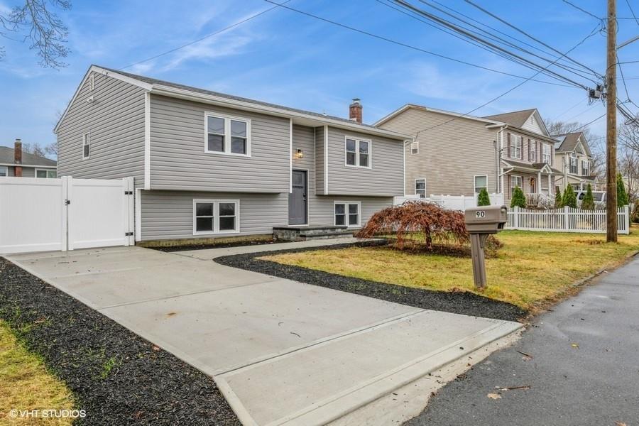 View of front of property with a front lawn