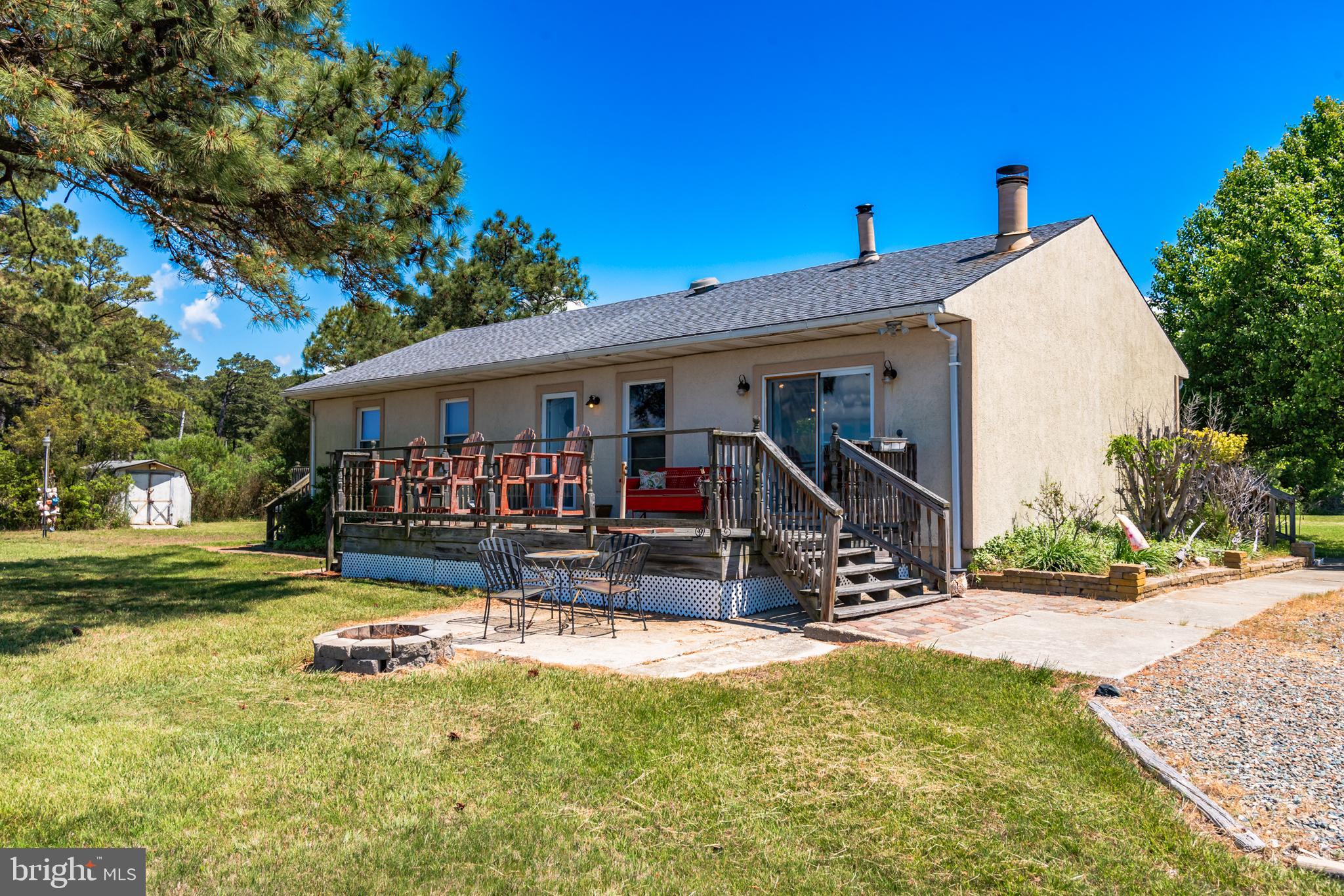 a view of a house with swimming pool and sitting area