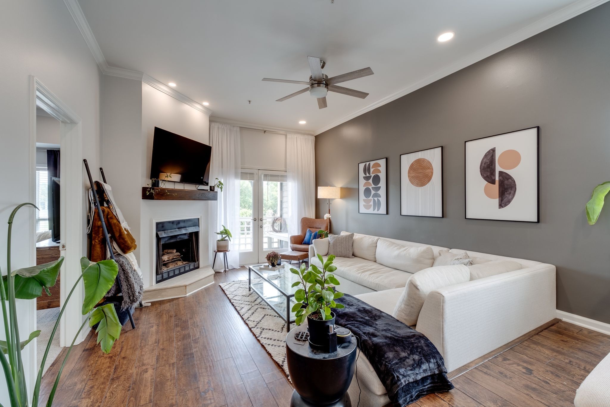 a living room with furniture fireplace and flat screen tv