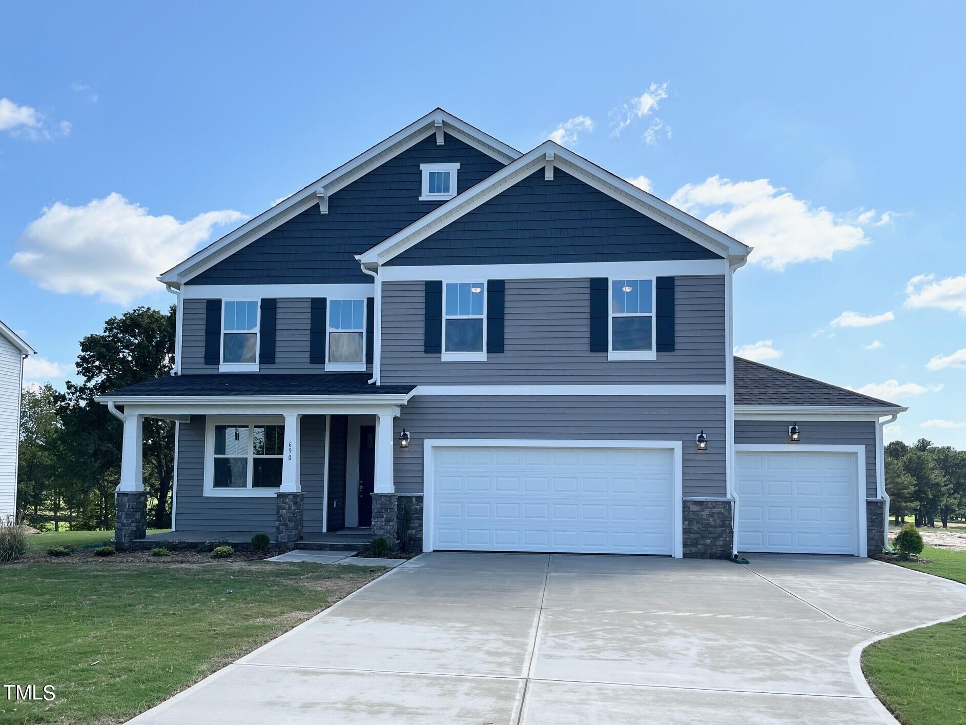 front view of brick house with a yard