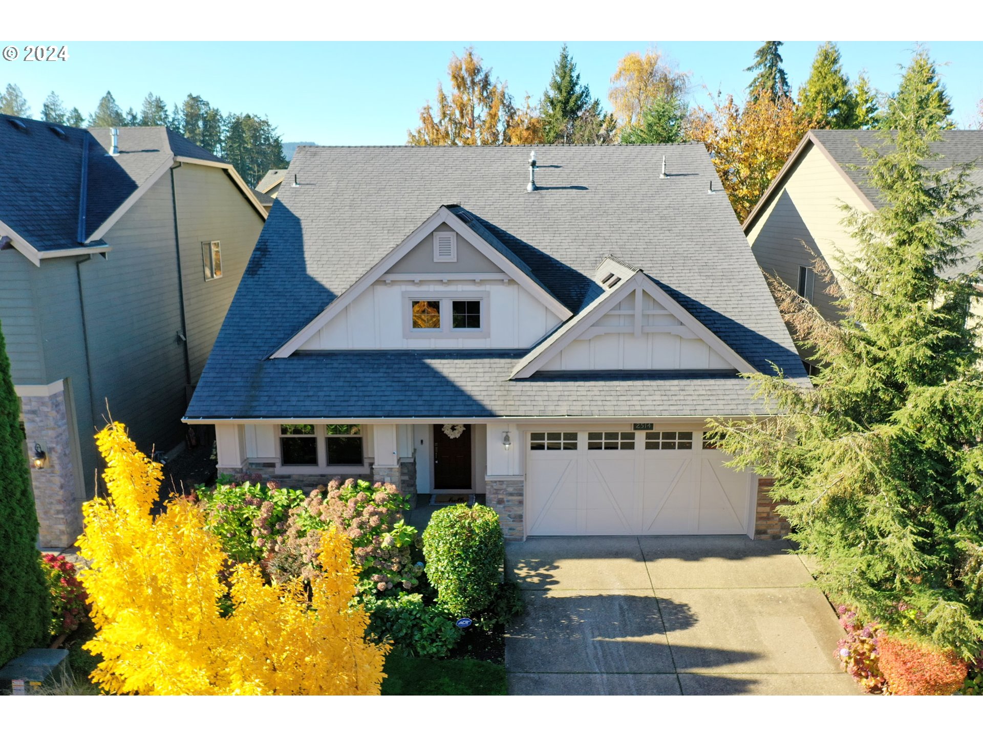 a aerial view of a house with swimming pool and porch