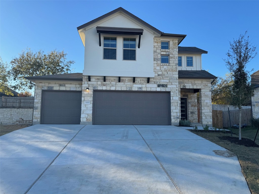 a front view of a house with yard