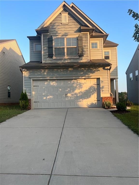 a front view of a house with a garage