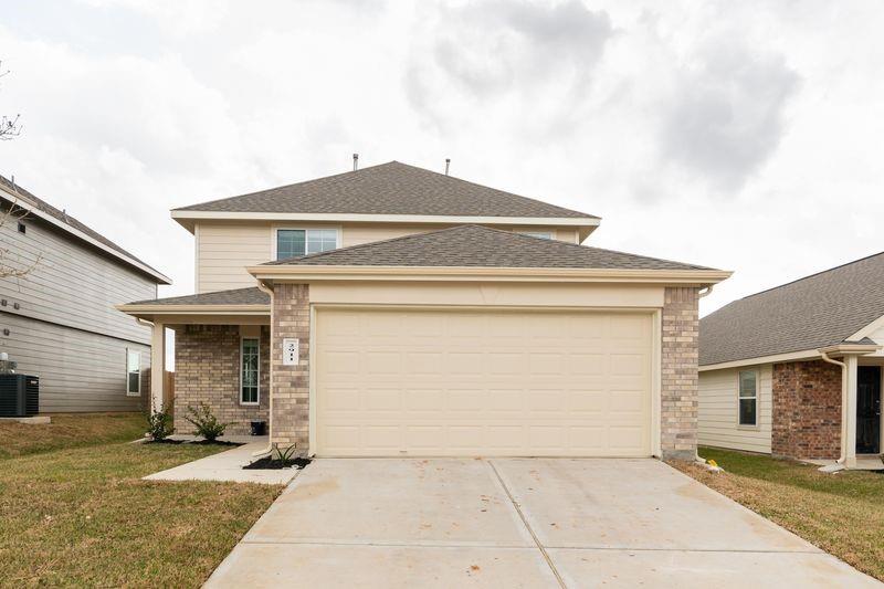 a front view of a house with yard