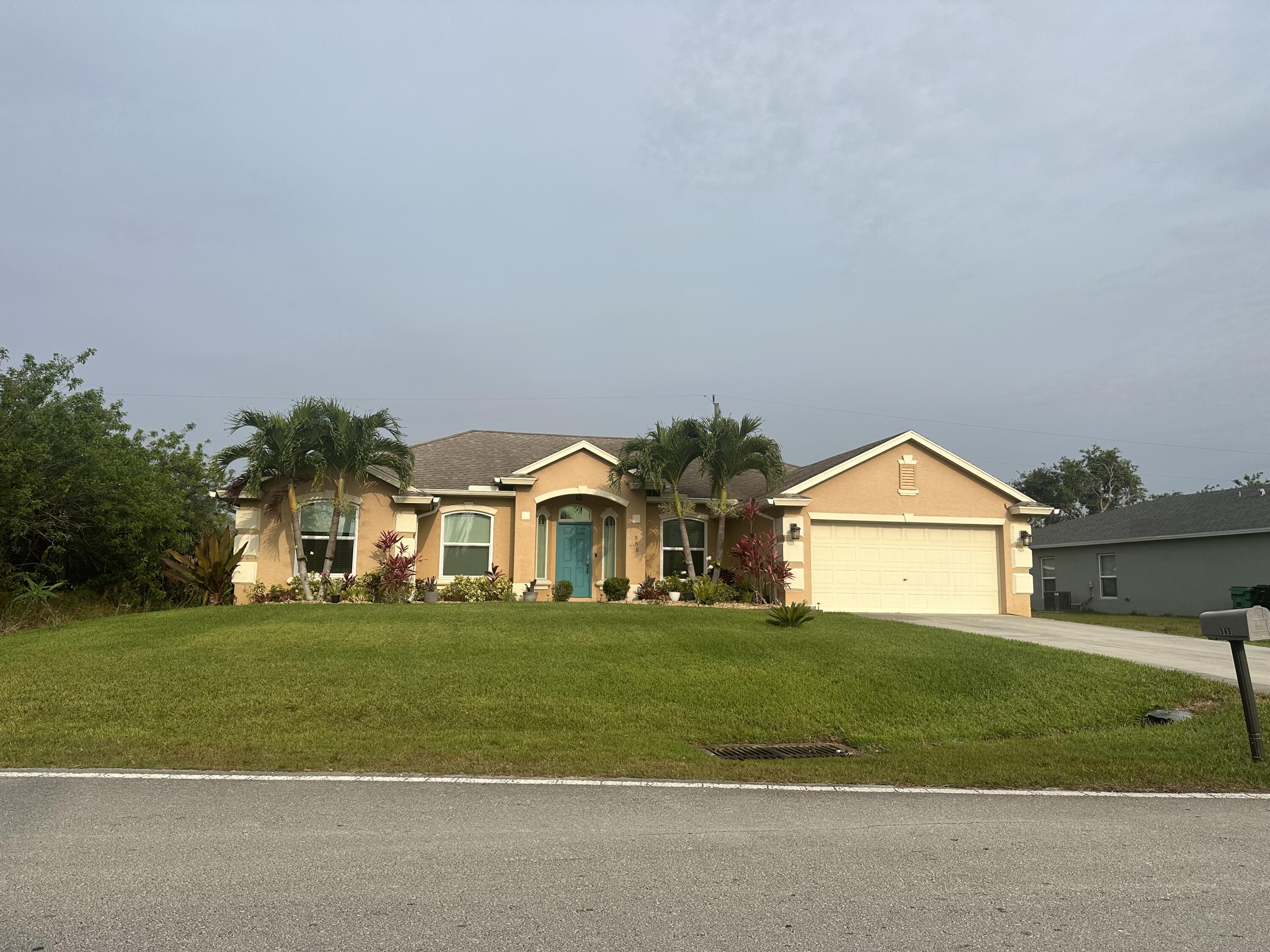 a front view of a house with a yard