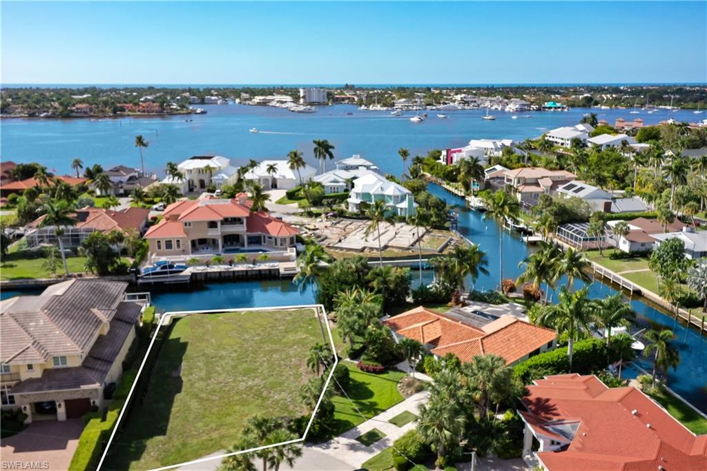 an aerial view of a house with a lake view