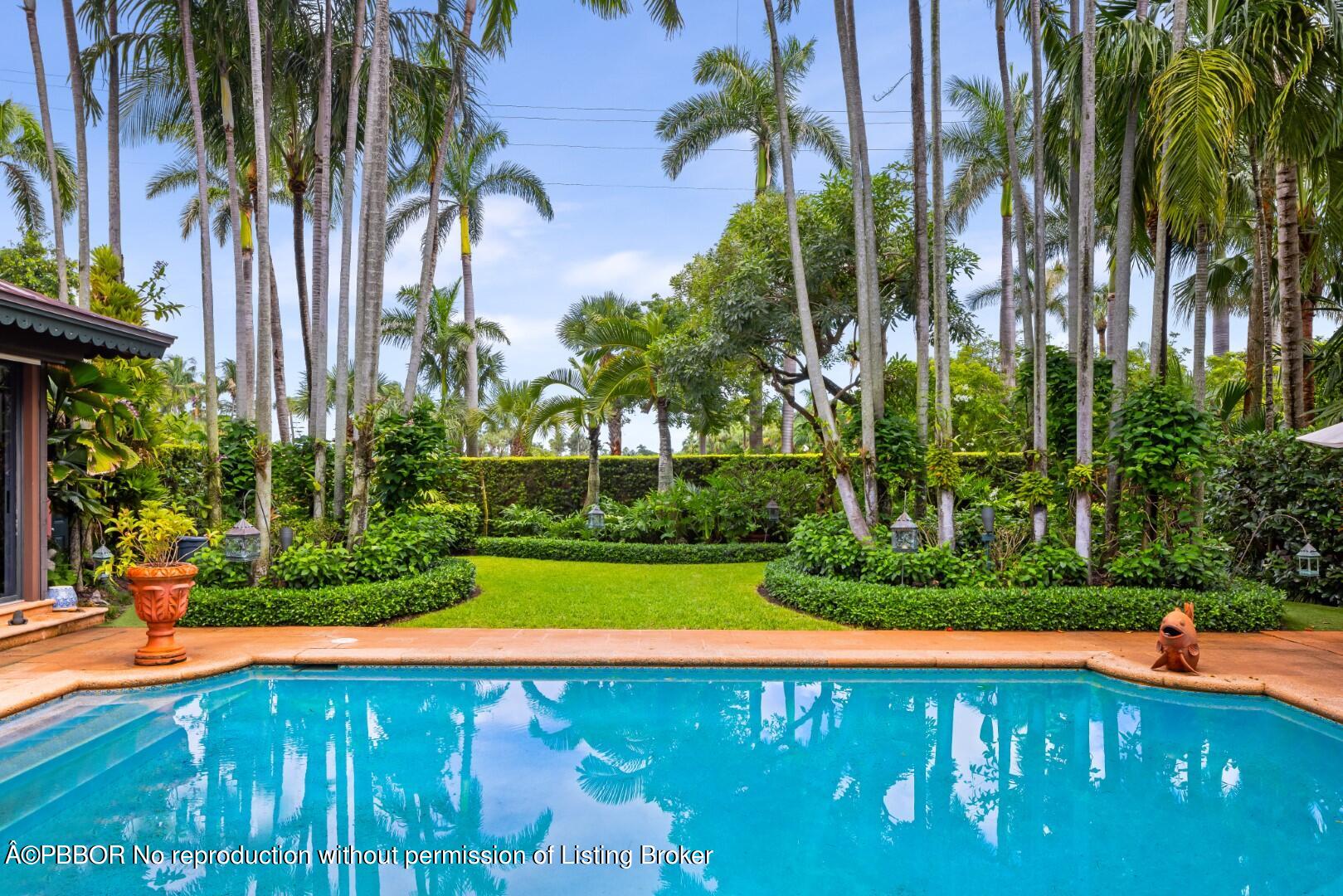 a view of a swimming pool with an outdoor space and seating area