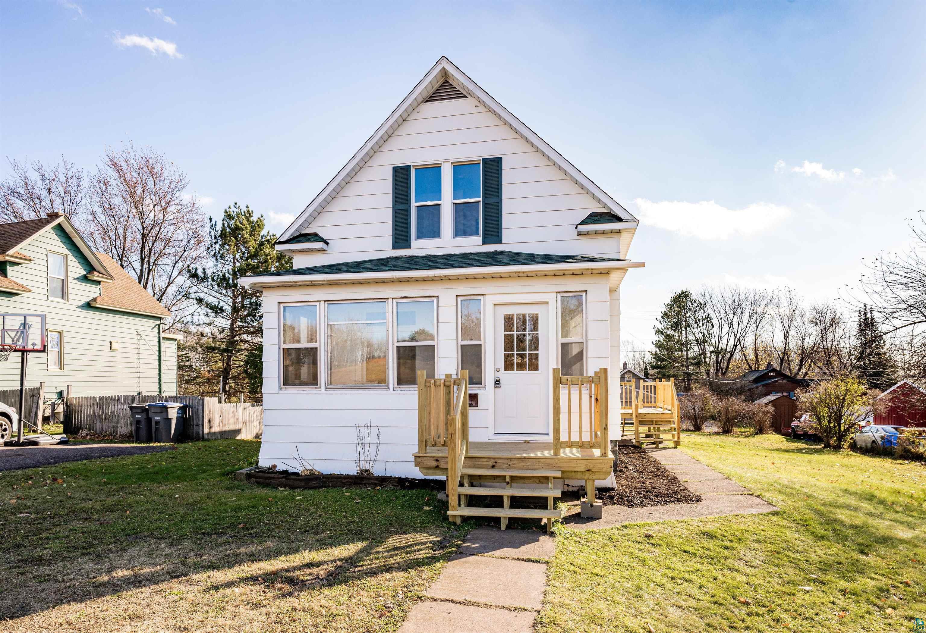 Bungalow-style house featuring a front lawn