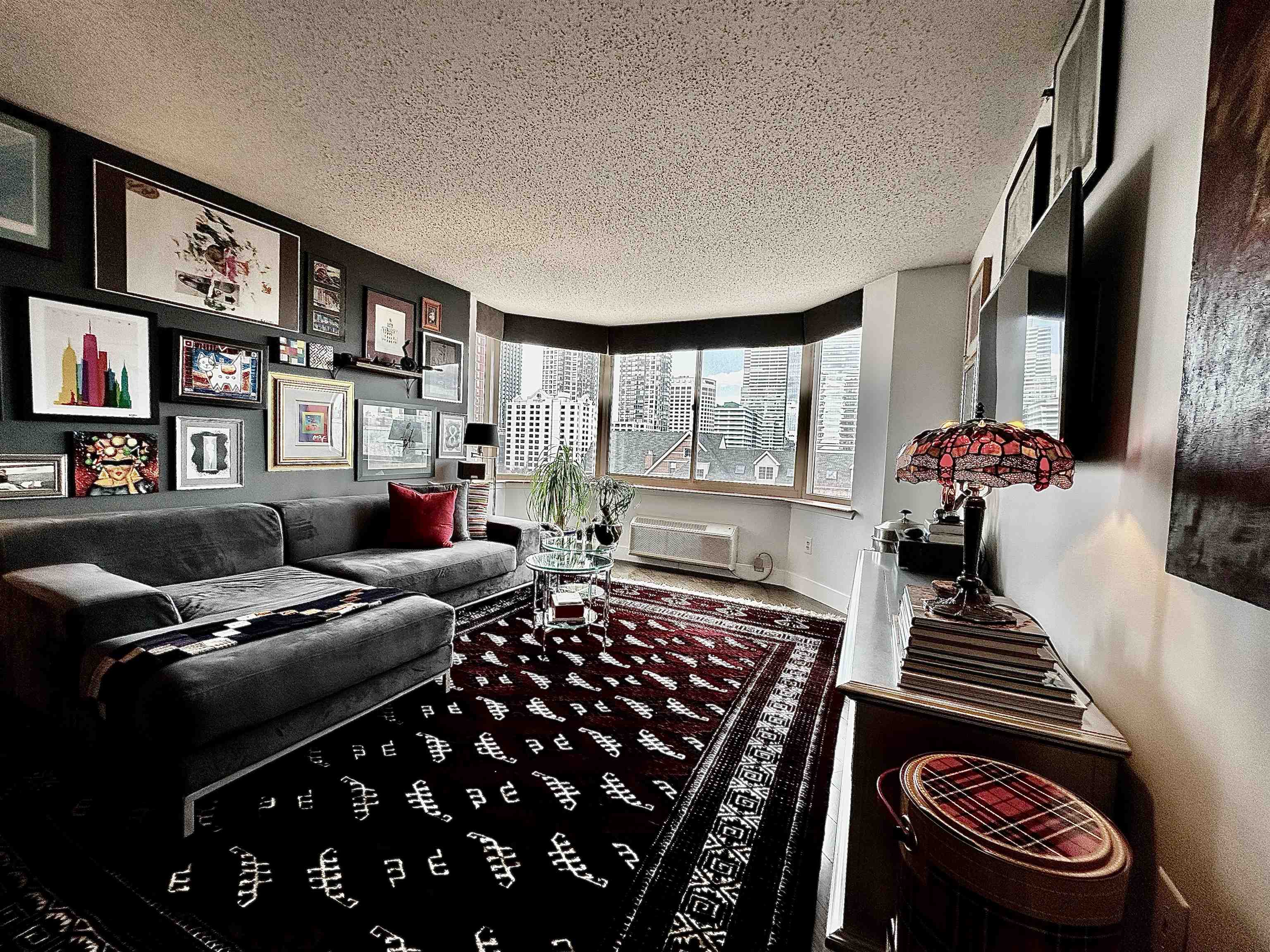 a bedroom with furniture and a book shelf