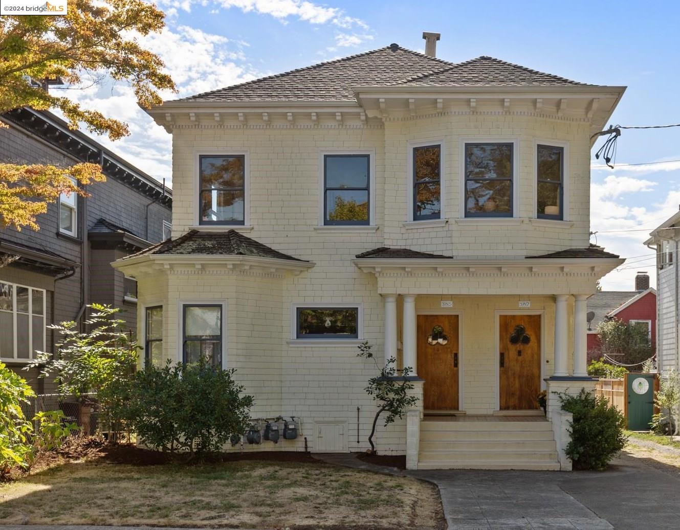 a front view of a house with garden