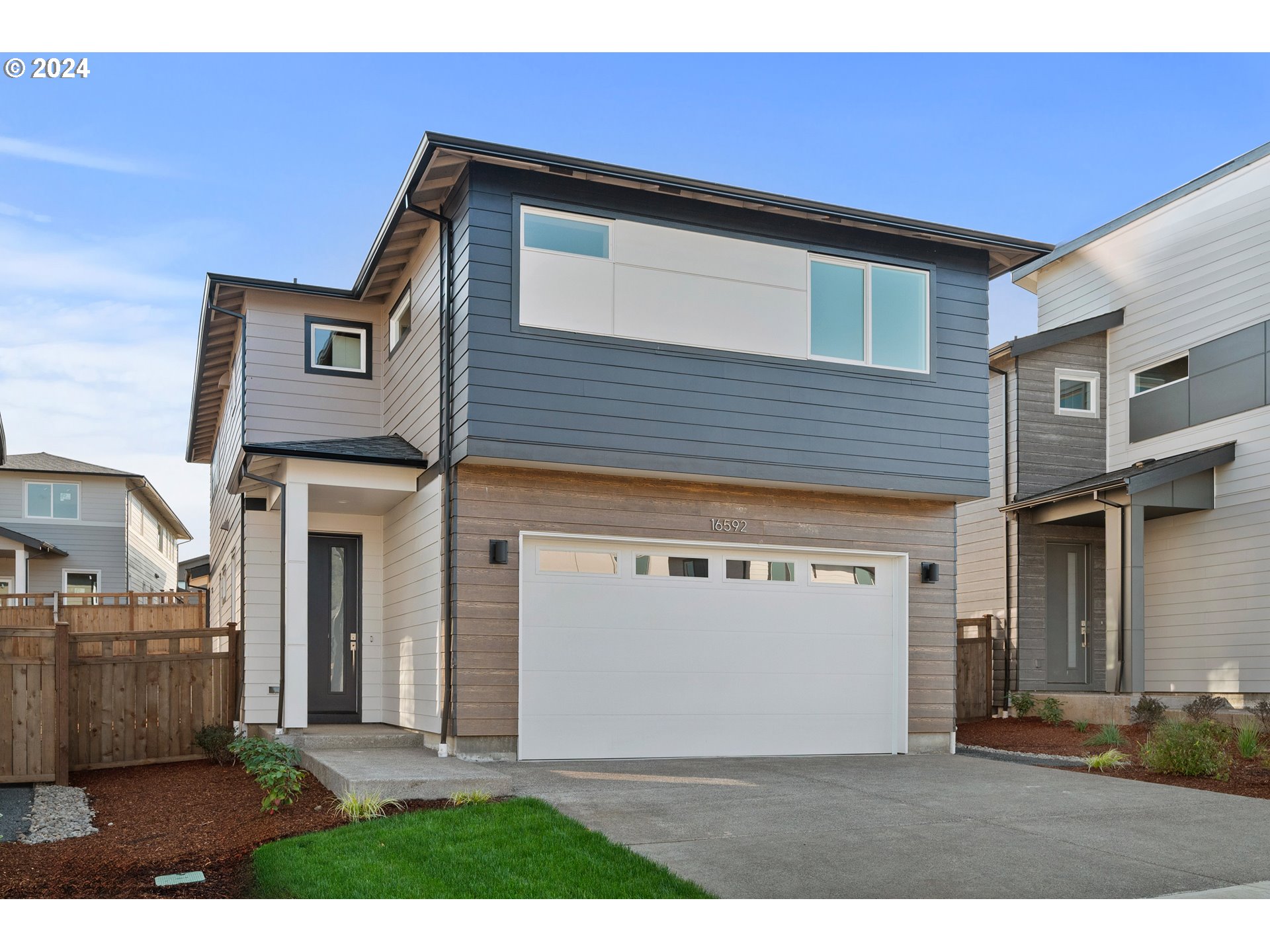 a front view of a house with a garage