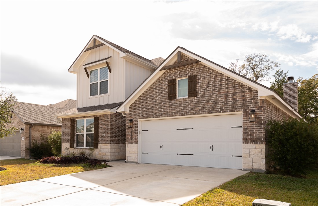 View of front property with a two car garage