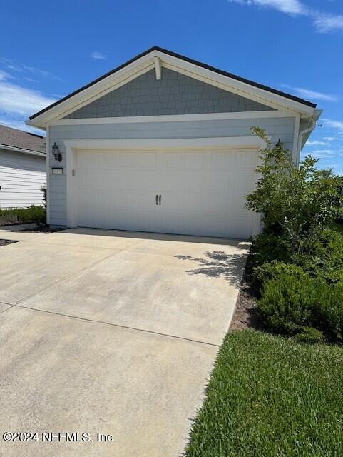 a view of backyard with garage