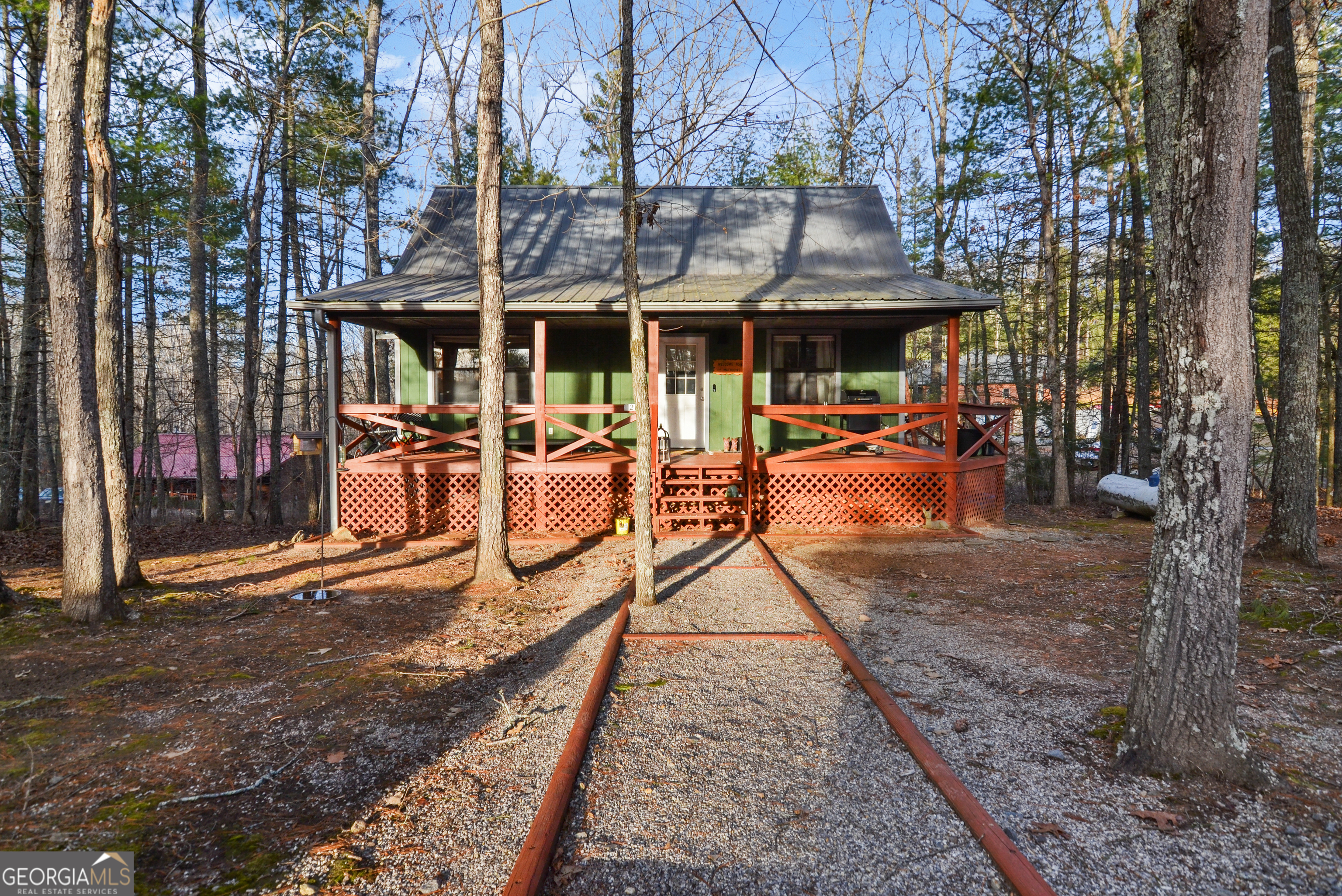 an outdoor space with lots of table and chairs