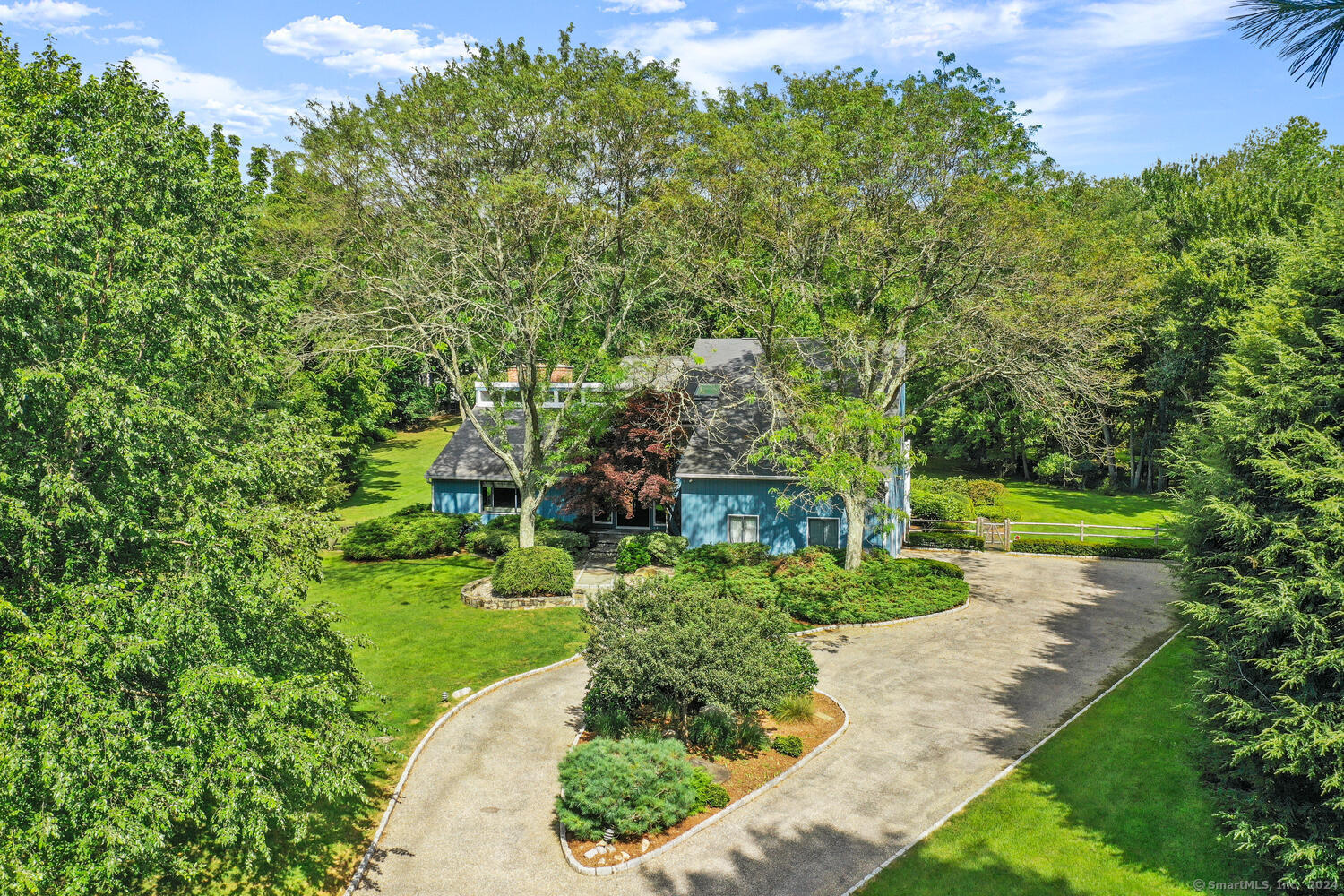 a view of a garden with a building in the background