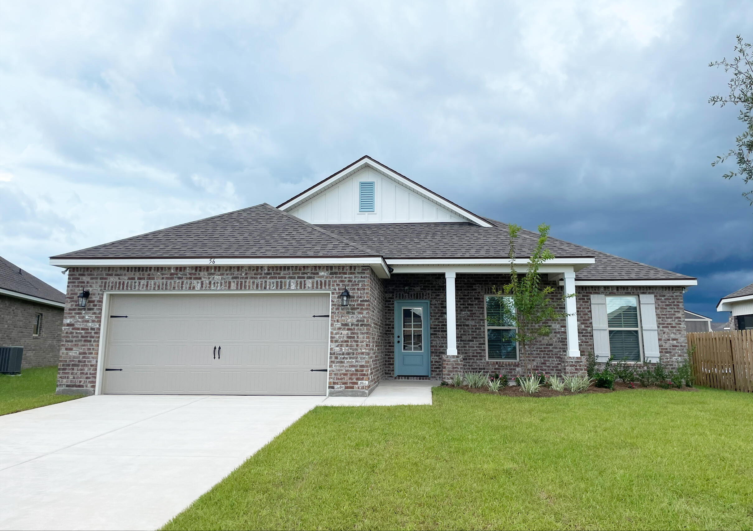 front view of a house with a yard