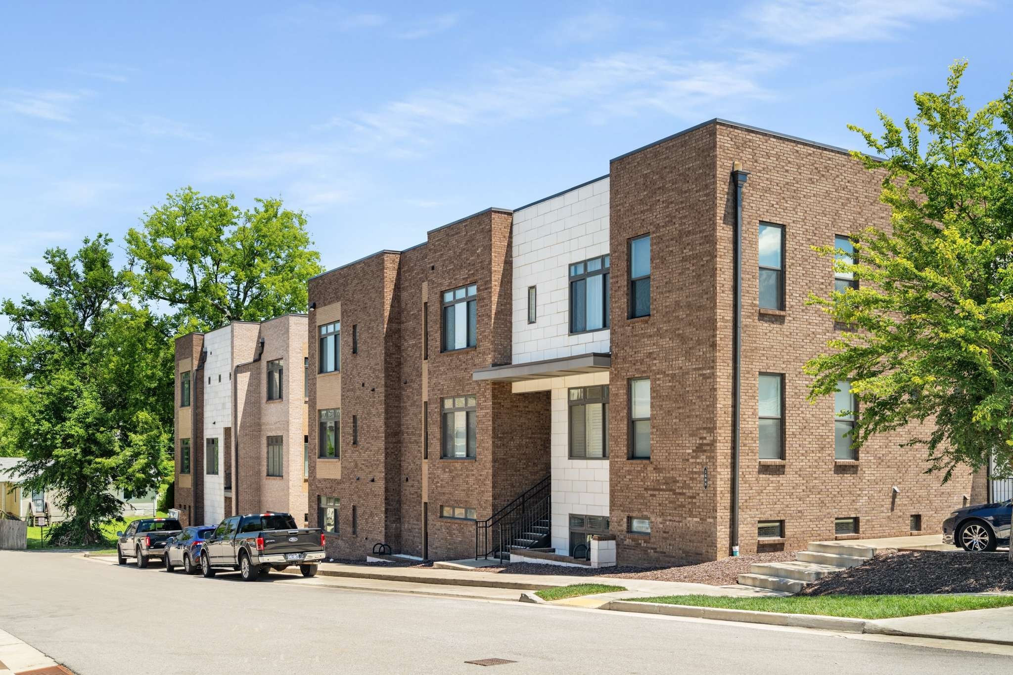 a front view of a building with street view