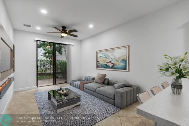 a living room with furniture rug and window