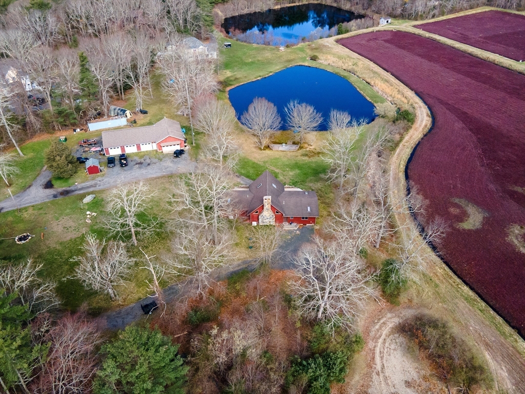 an aerial view of a house with a swimming pool