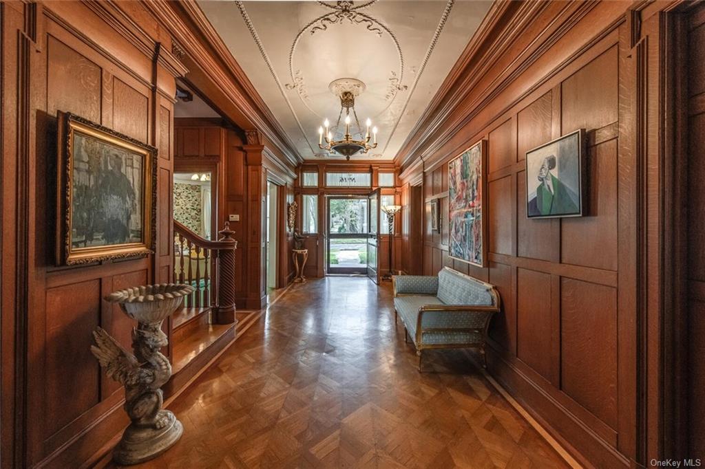 a lobby with furniture and a large window