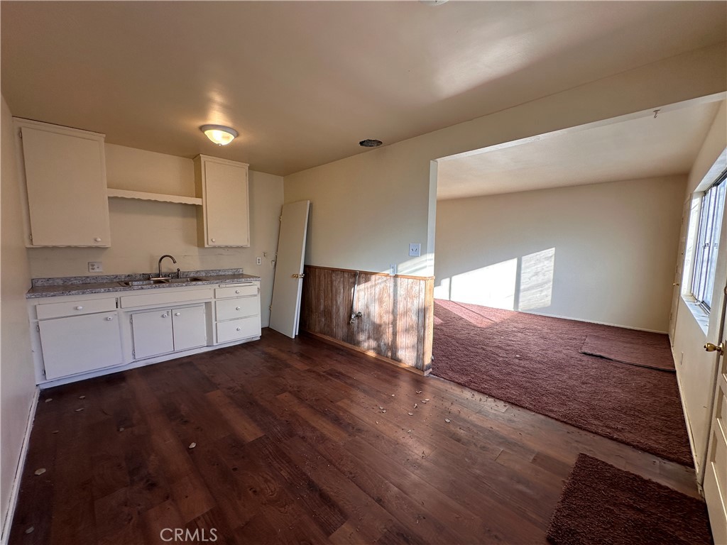 a view of a kitchen with a sink cabinets and a window