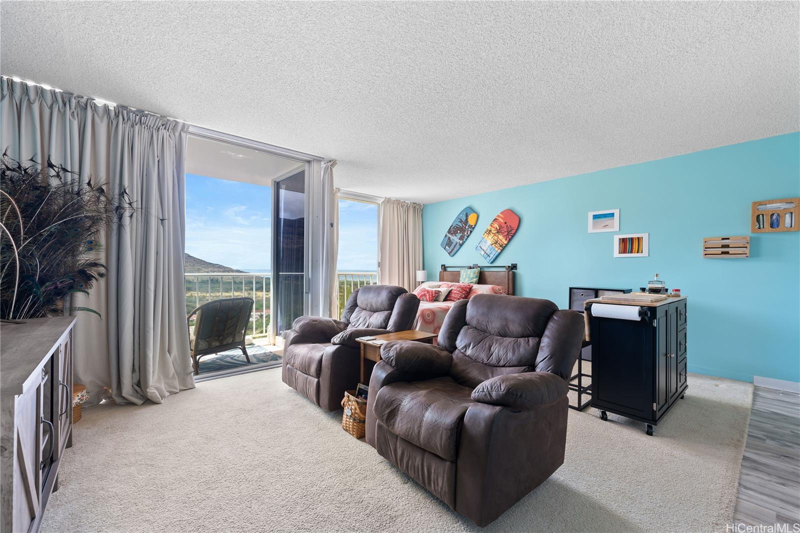 a living room with furniture a floor to ceiling window and a flat screen tv