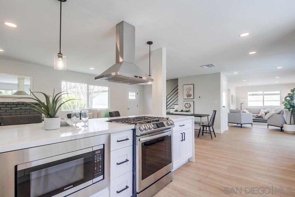 a kitchen with a stove and cabinets