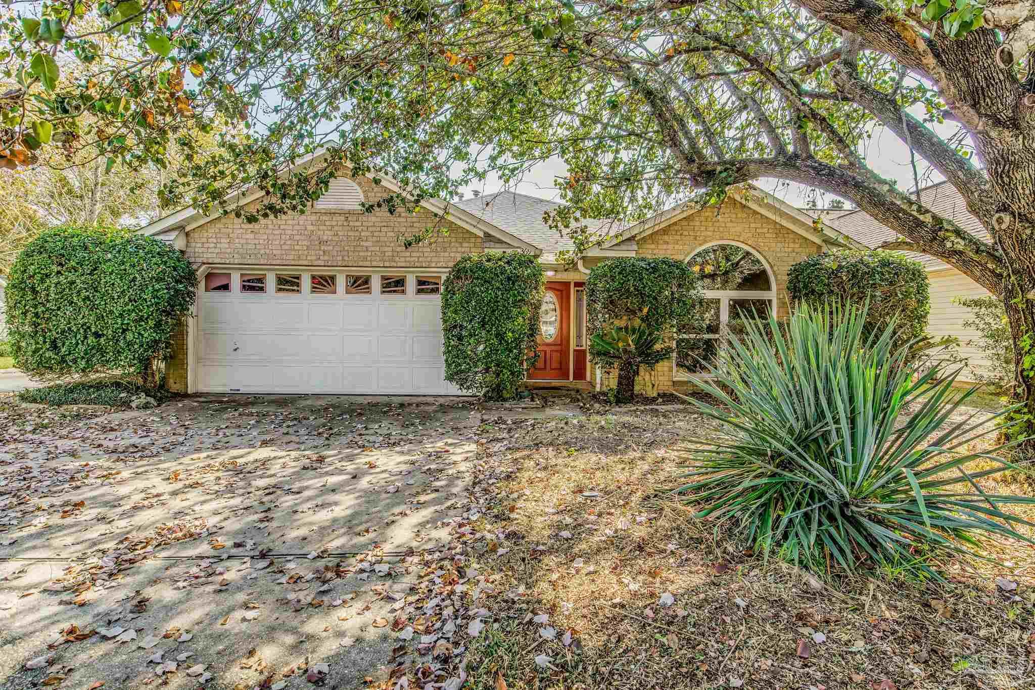 a view of a house with a tree