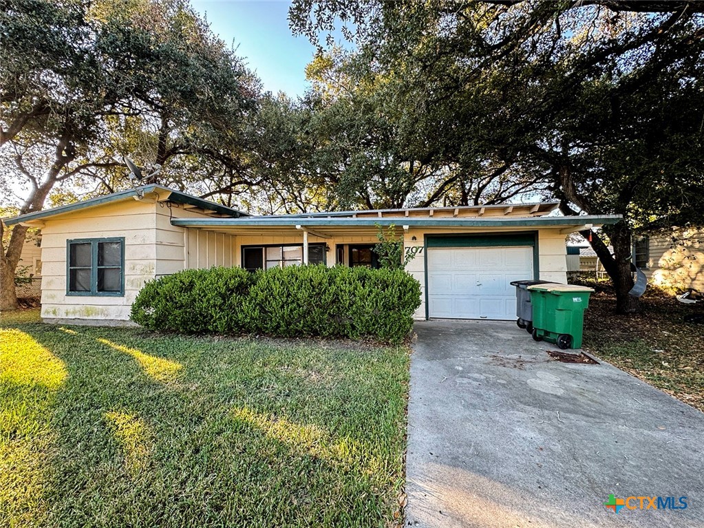 front view of a house with a big yard