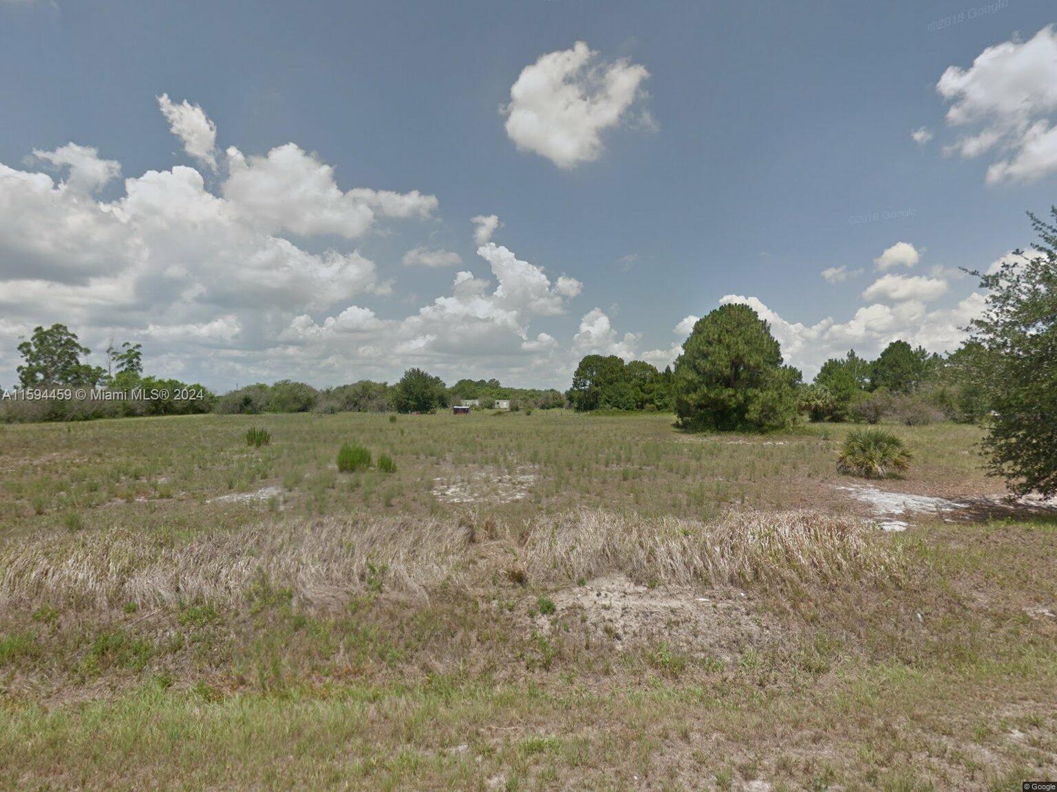 a view of a lake with a yard