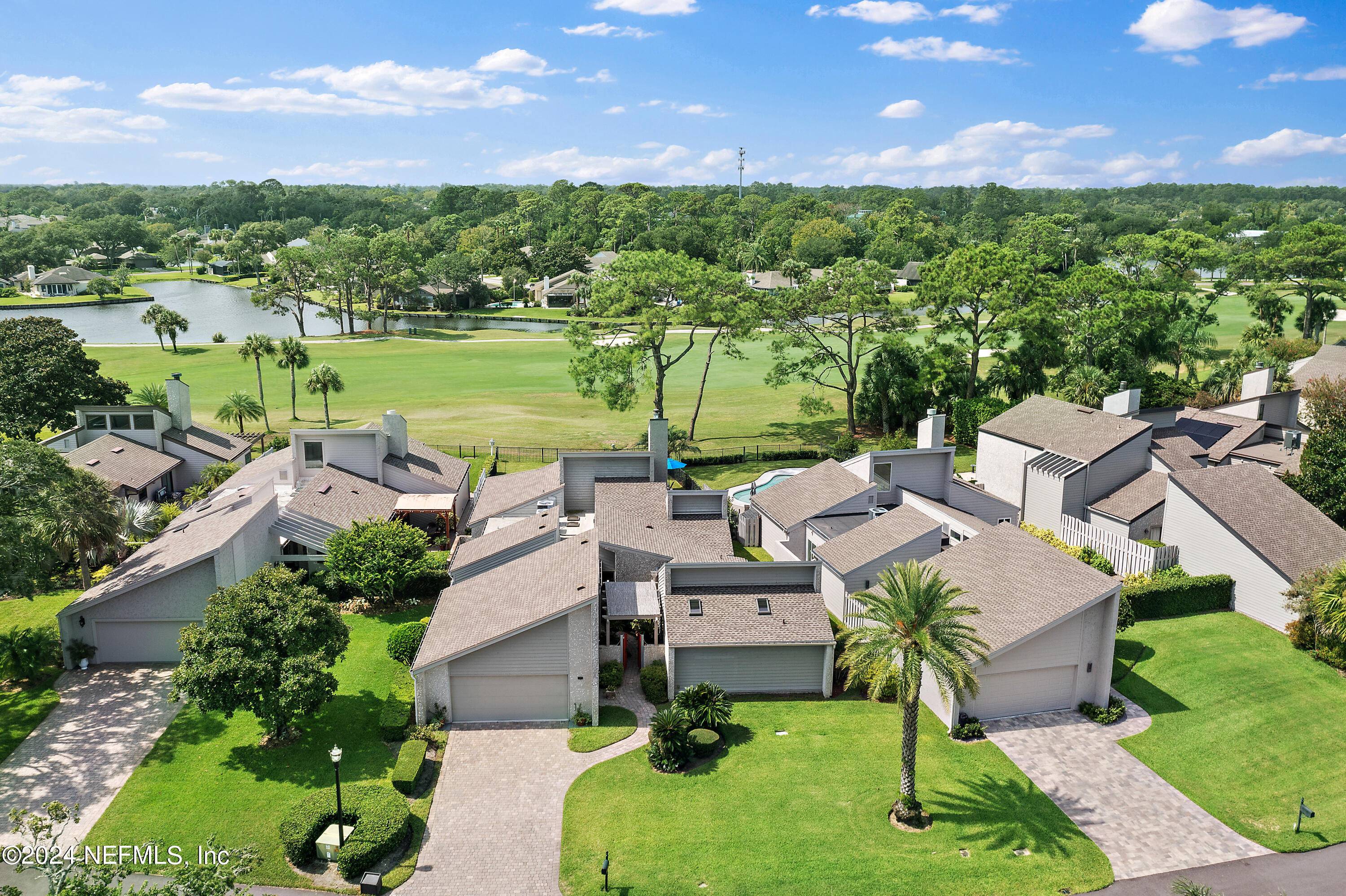 a view of a lake with a yard