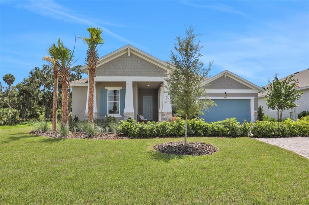 a front view of house with yard and green space