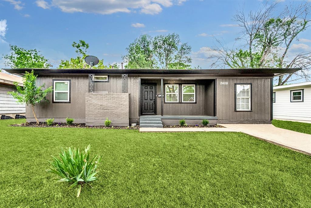 front view of a house with a yard