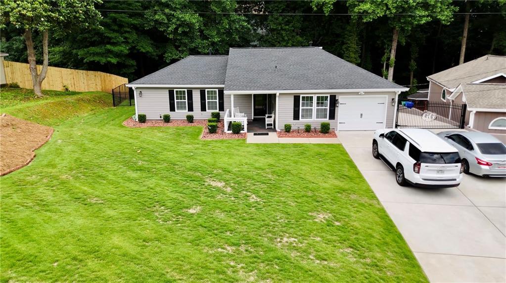 a front view of a house with garden