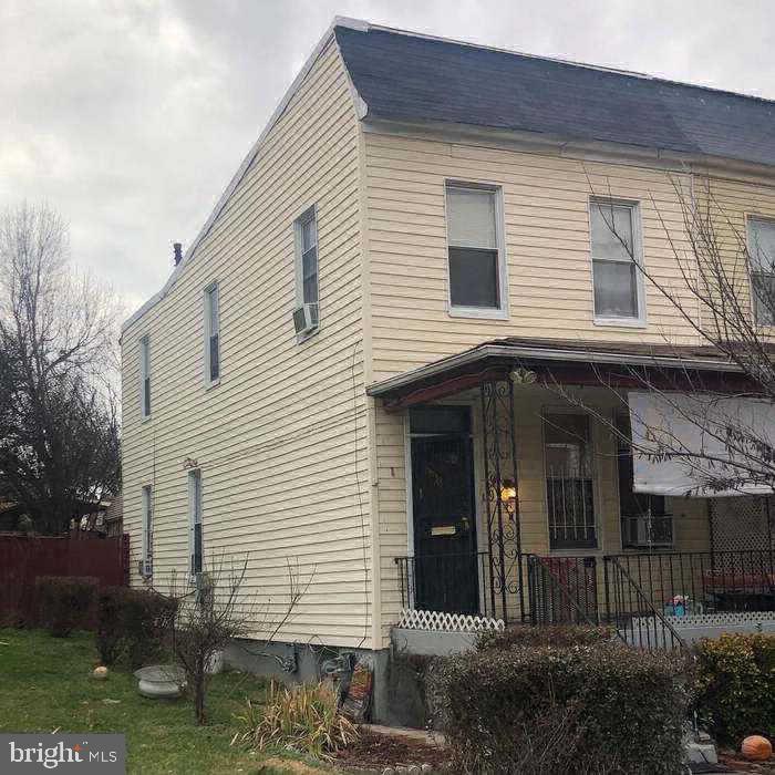 a view of a house with brick walls