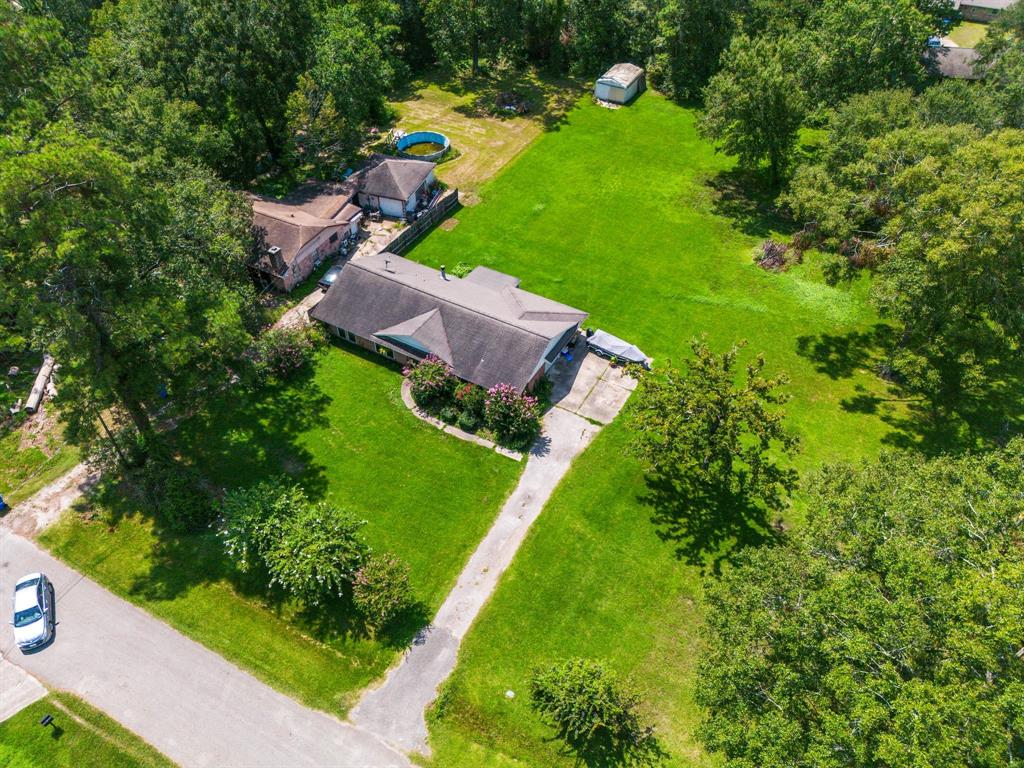 an aerial view of a house with a yard