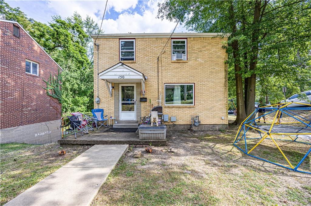 a front view of a house with patio