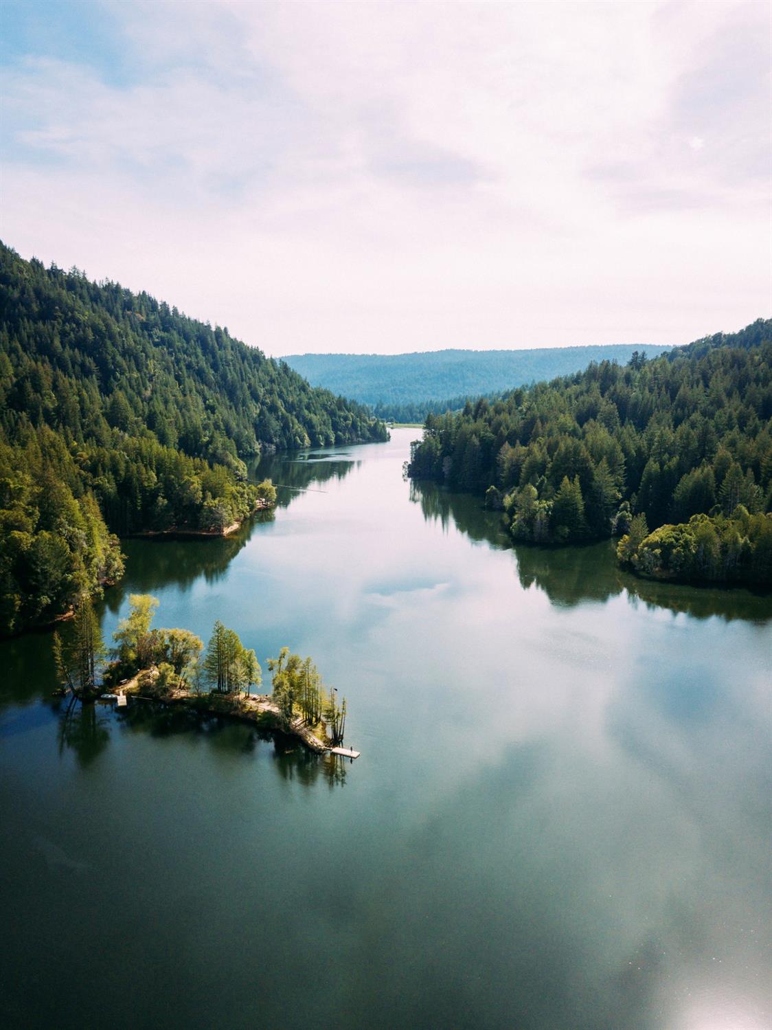 an aerial view of a house with a lake view