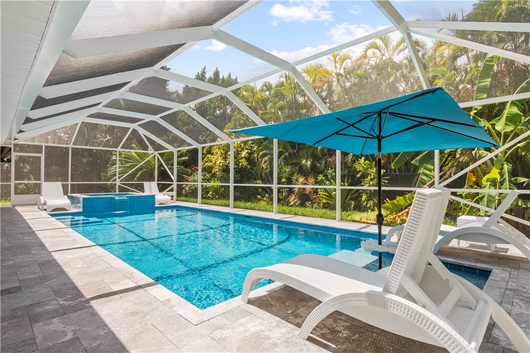 a view of a swimming pool with a patio