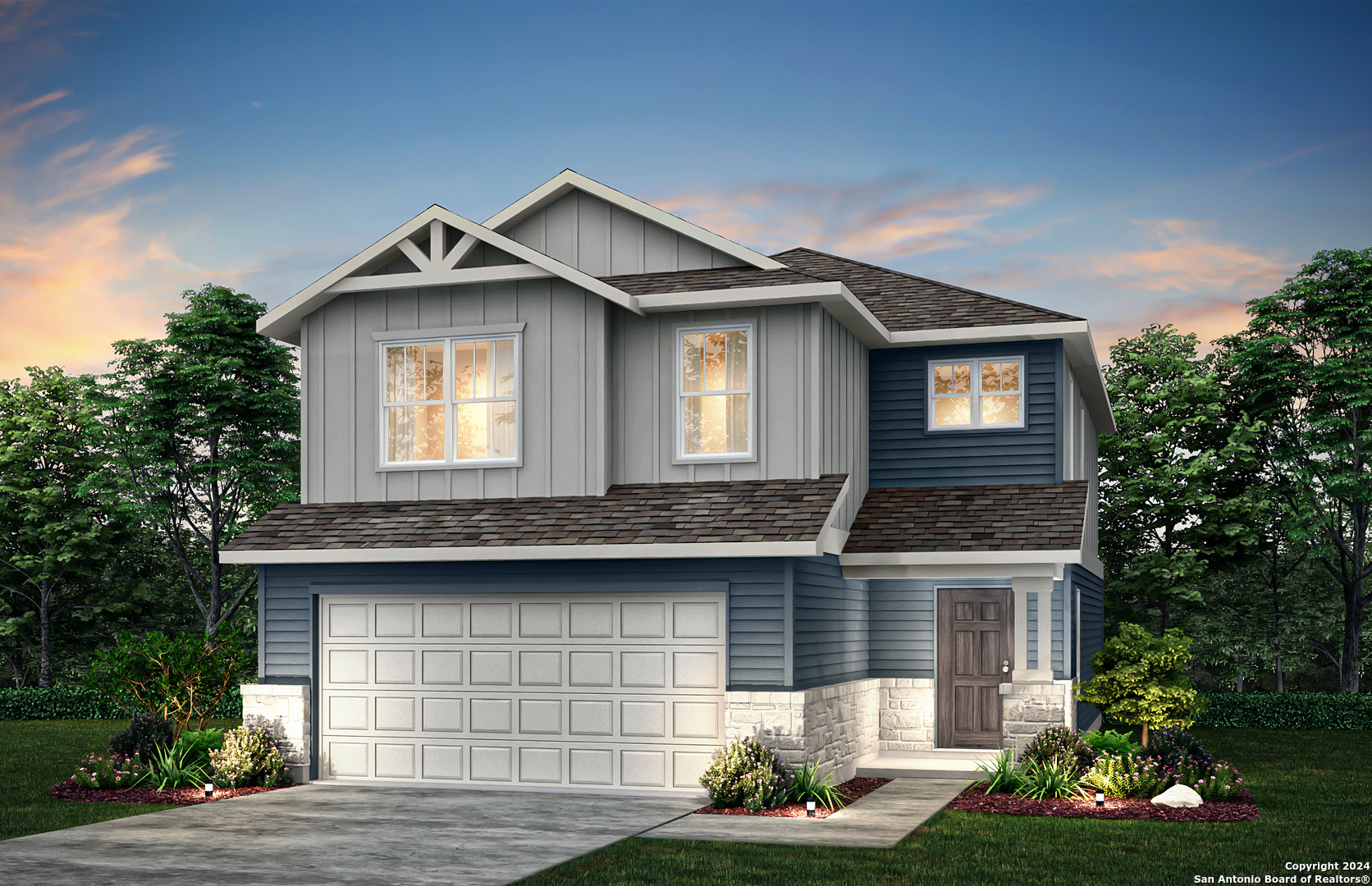 a front view of a house with a yard and garage