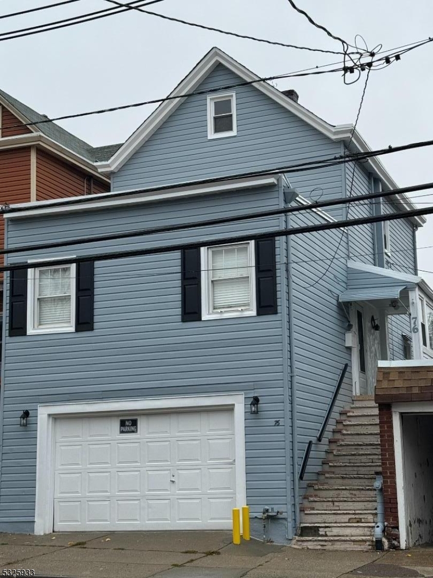 a view of a house with a street