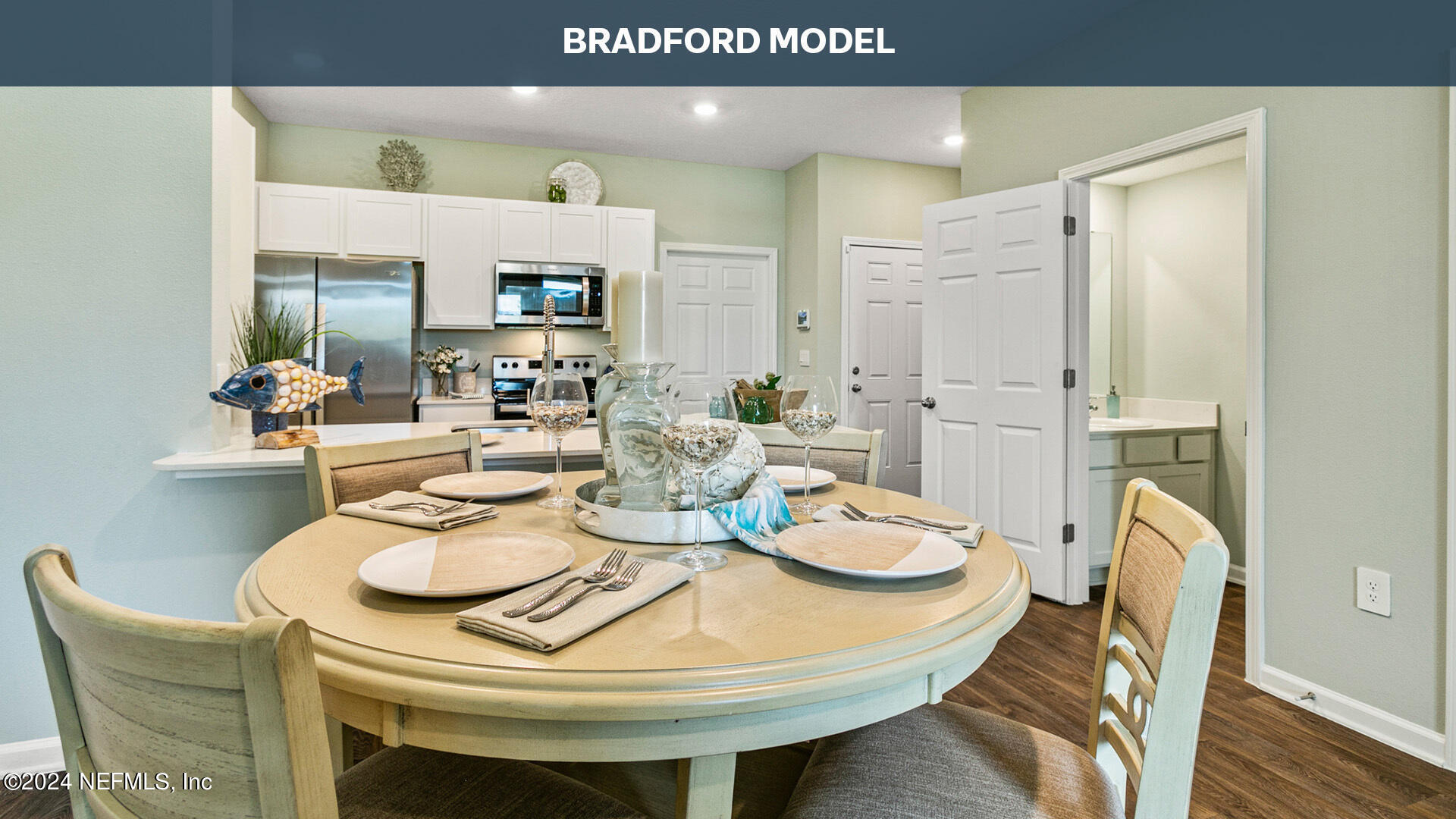 a dining room with furniture and wooden floor