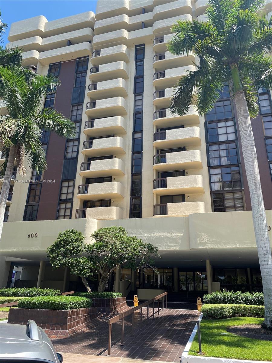 a front view of a building with garden