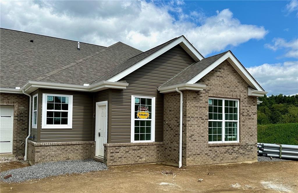 a front view of a house with a garage