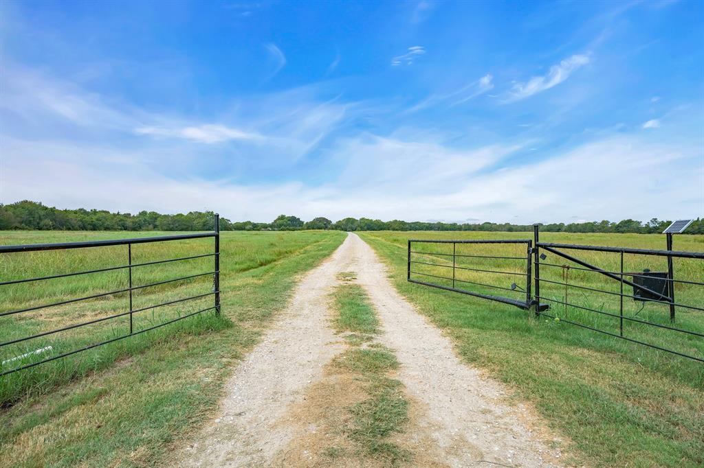 a view of park with wooden fence