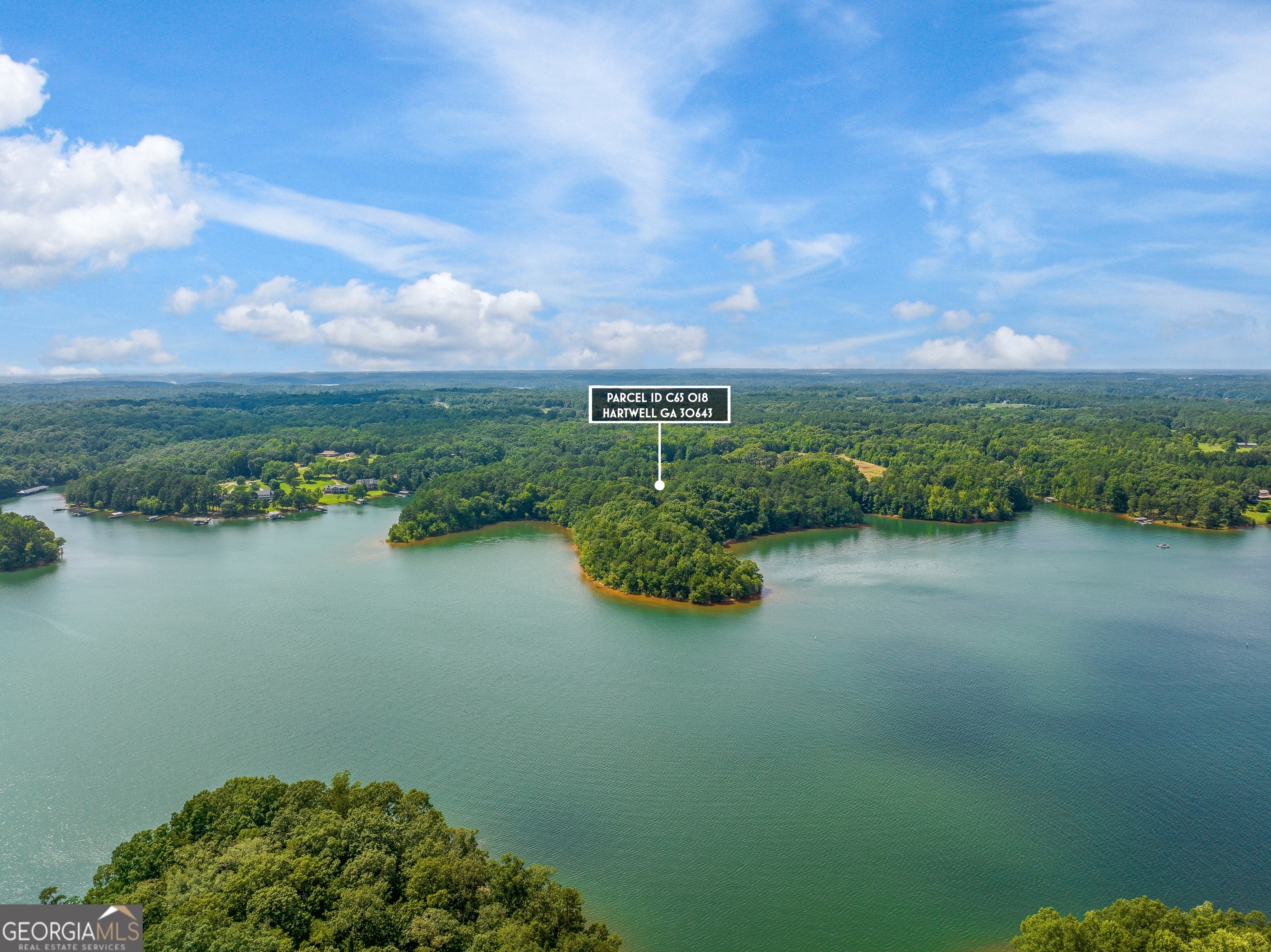 a view of a lake with a yard